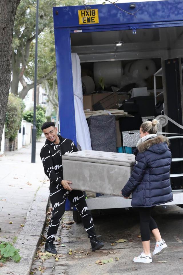  Megan and Wes prove they aren't afraid to get their hands dirty as they move furniture into their new home