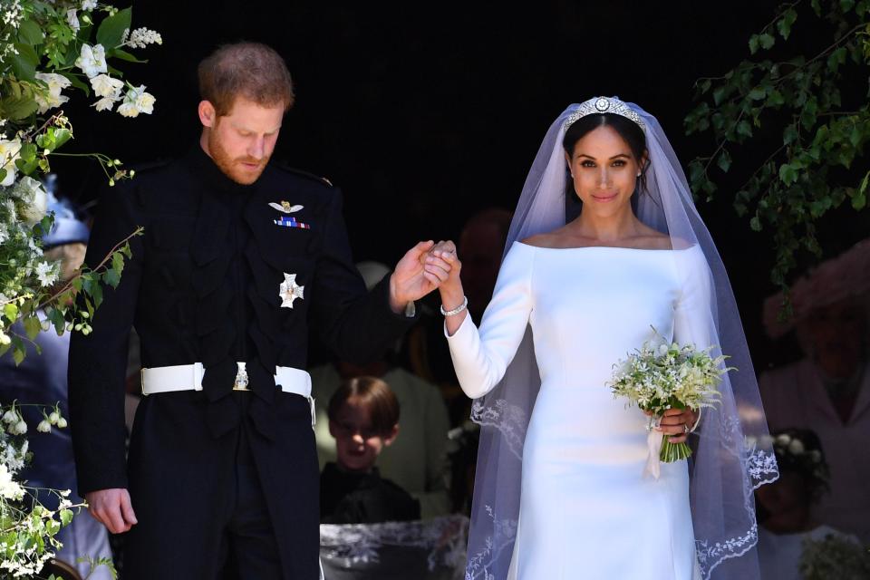  Prince Harry and Meghan Markle emerge from St George's Chapel after their wedding ceremony