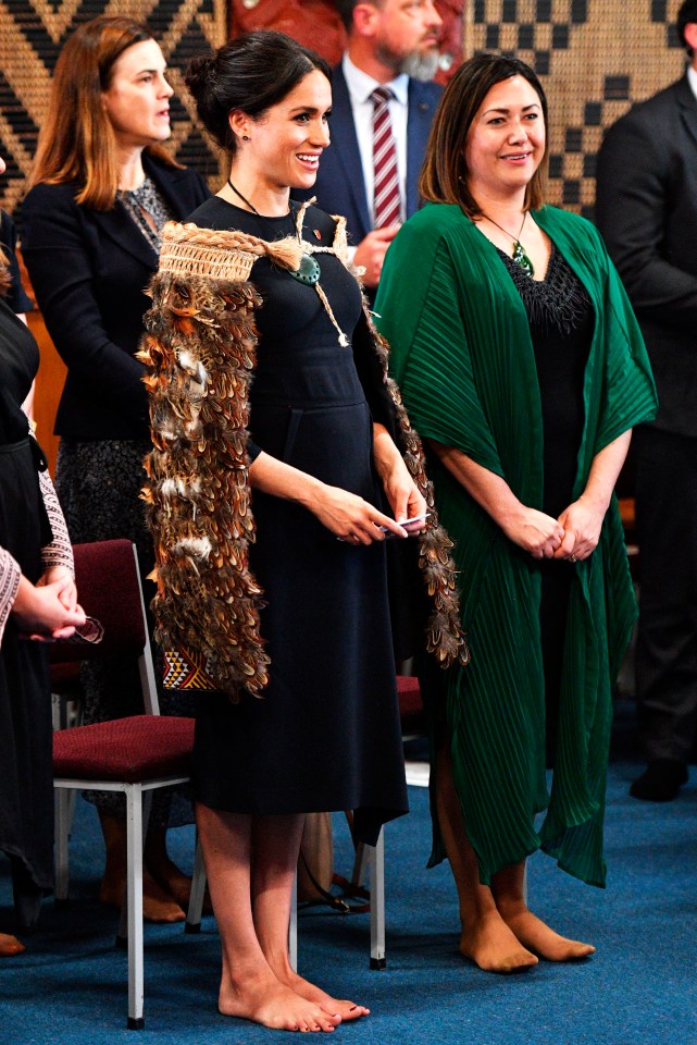 Meghan ditched her Manolo’s for a traditional Maori ceremony