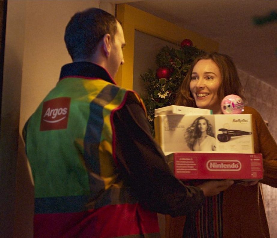  One scene near the end of the advert shows a mum taking an Argos delivery of toys