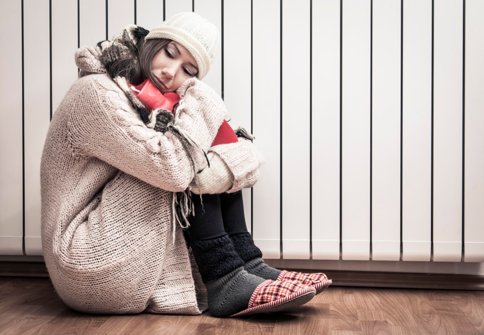 Woman freezing at home