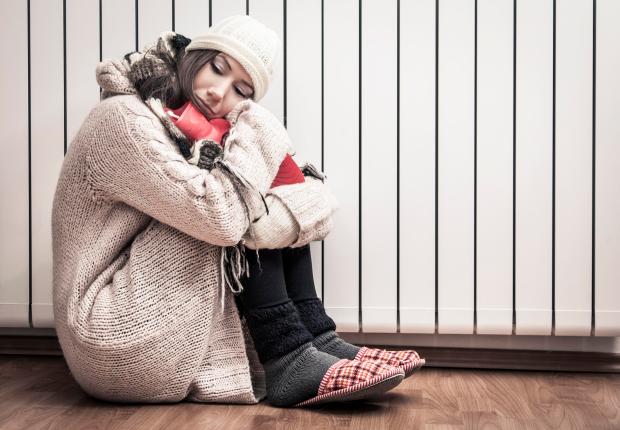 Woman freezing at home