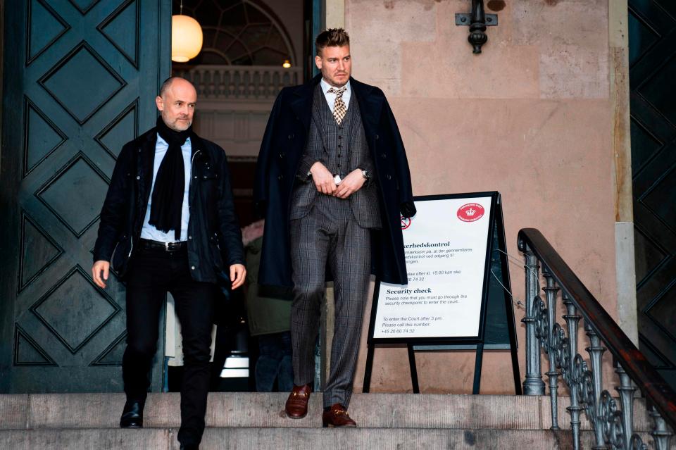  Bendtner and lawyer Anders Nemeth leave the court after the sentencing