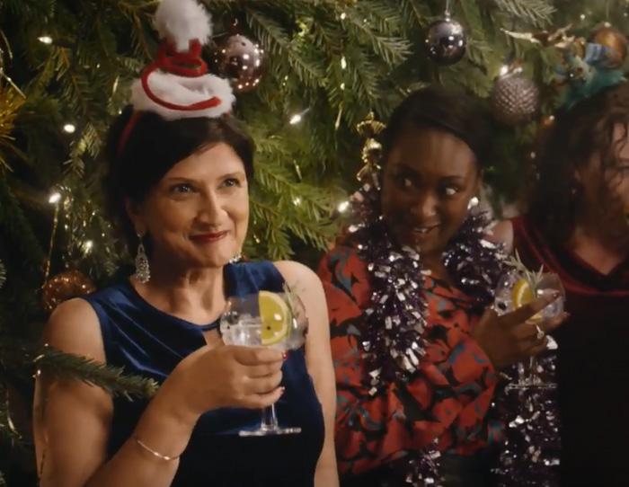  The third advert shows a happy woman drinking Lidl gin