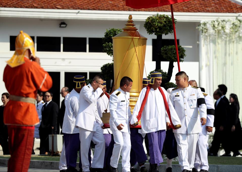  The remains of the 60-year-old billionaire will be placed in a giant cold urn donated by the King of Thailand and was the centre of the procession this morning