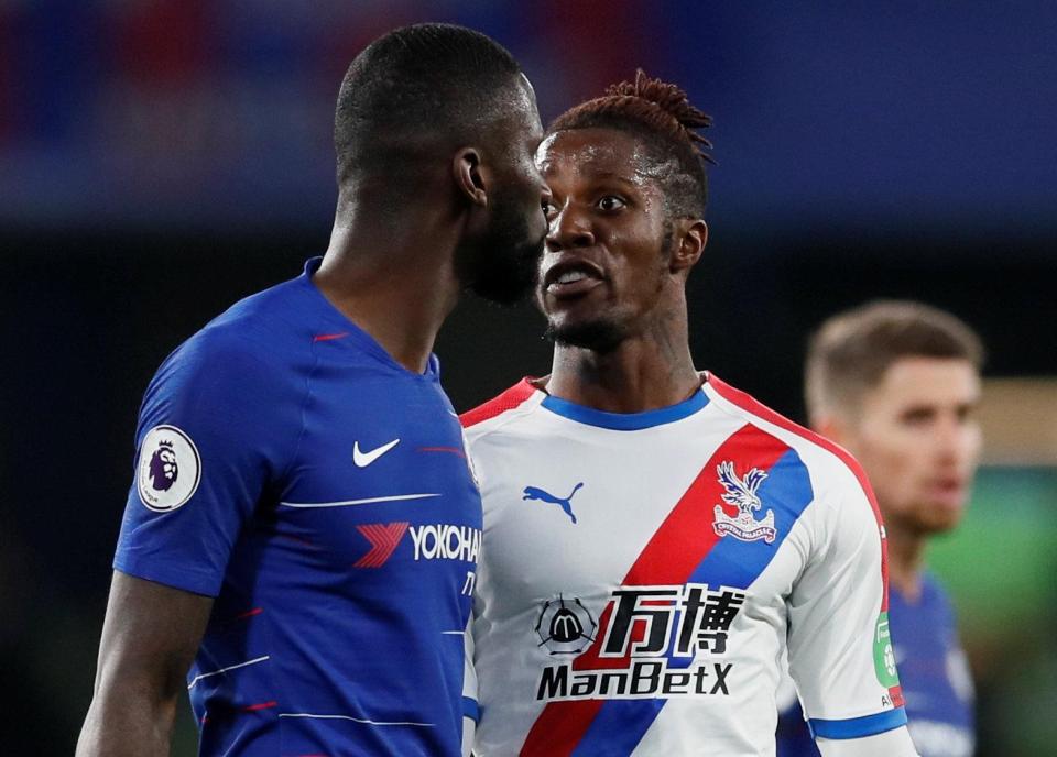  Antonio Rudiger, left, clashes with Wilfried Zaha during Sunday's game