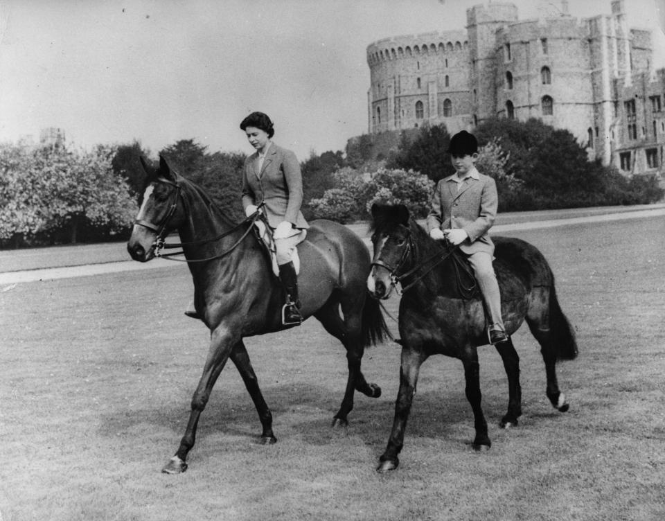  1961: Queen Elizabeth and her son, Prince Charles, out riding at Windsor Castle