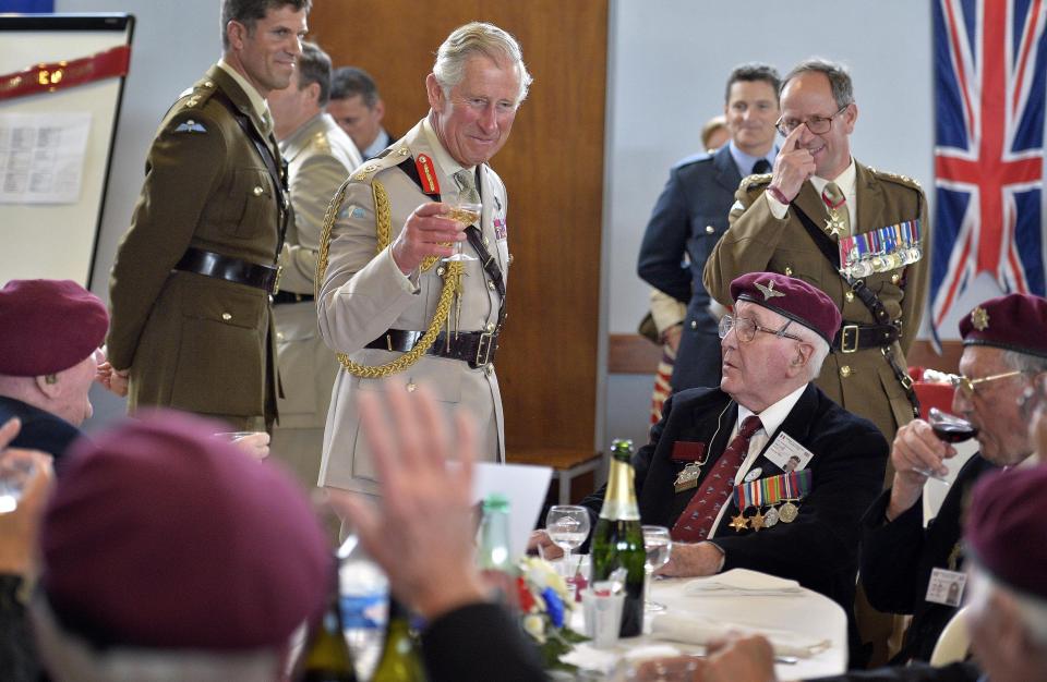  2014: Prince Charles raising his glass to D-Day veterans during lunch at a community centre in Ranville, Normandy, France, as part of the 70th anniversary of the D-Day campaign