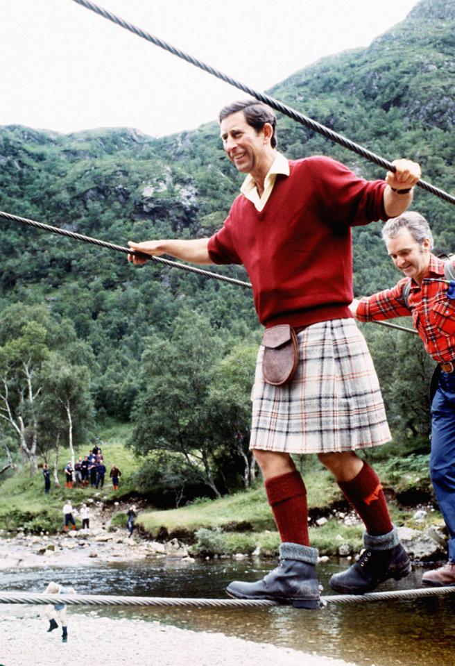  1987: The Prince of Wales negotiating a 2 inch wide wire bridge during a trek in the foothills of Ben Nevis with the Lochaber Mountain Rescue Team