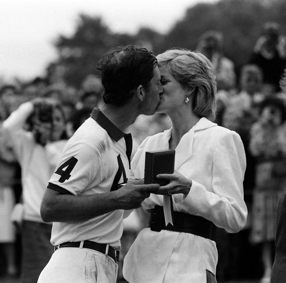  1986: Diana gives Charles a kiss after he played for the England II team against Chile at the Cartier International Polo Spectacular at the Guards Polo Club in Windsor Great Park, Berkshire