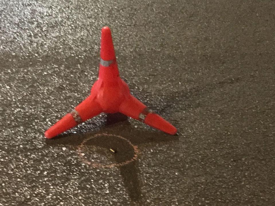  A police cone marks the location of a spend bullet shell in Estepona following a Saturday night shooting