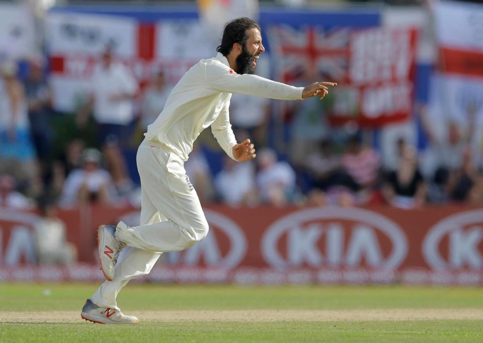  England's Moeen Ali celebrates taking the wicket of Niroshan Dickwella on the second day of the First Test