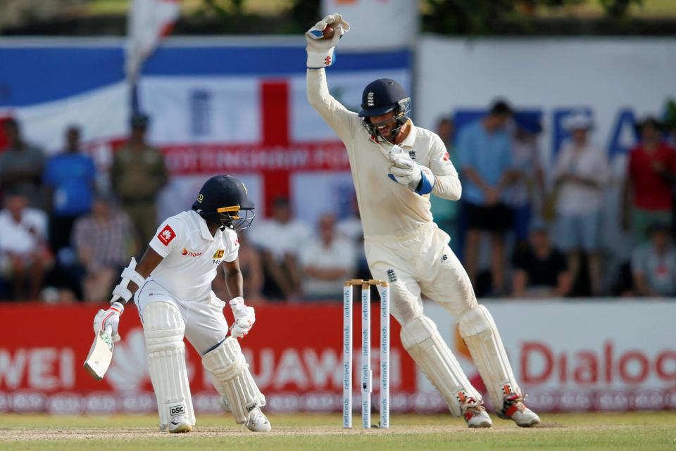  Wicketkeeper Ben Foakes celebrates after taking a catch to dismiss Akila Dananjaya