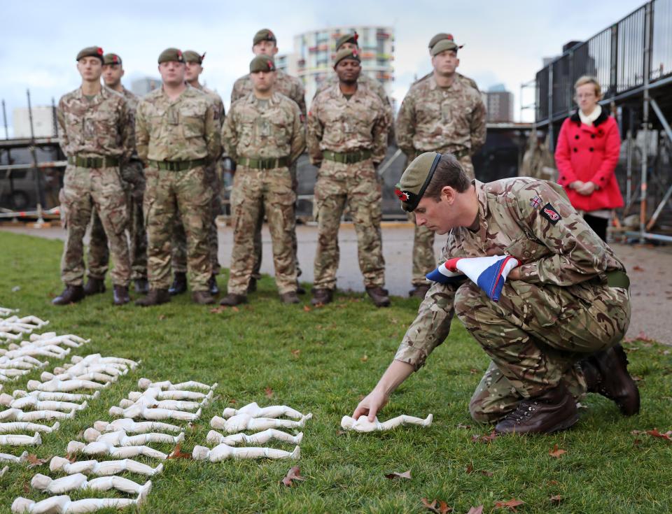  A solider lay the very last shroud to rest in the Olympic Park