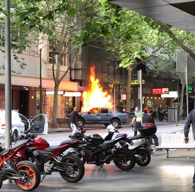 Witnesses said the car exploded as the attacker lunged at police officers in Melbourne today