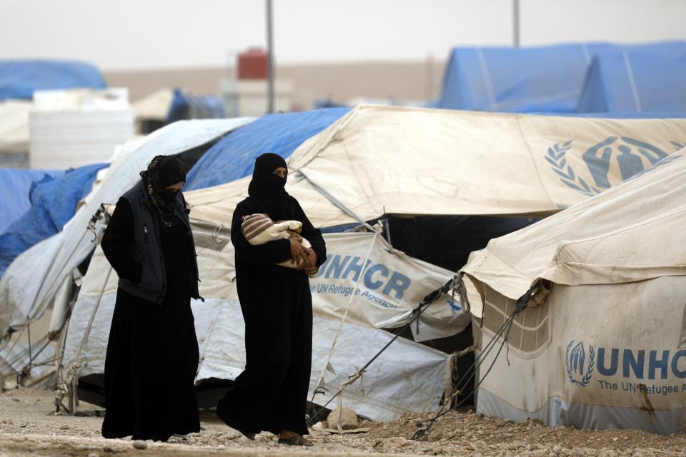  Women walking around the Ain Issa camp in October this year (file photo)