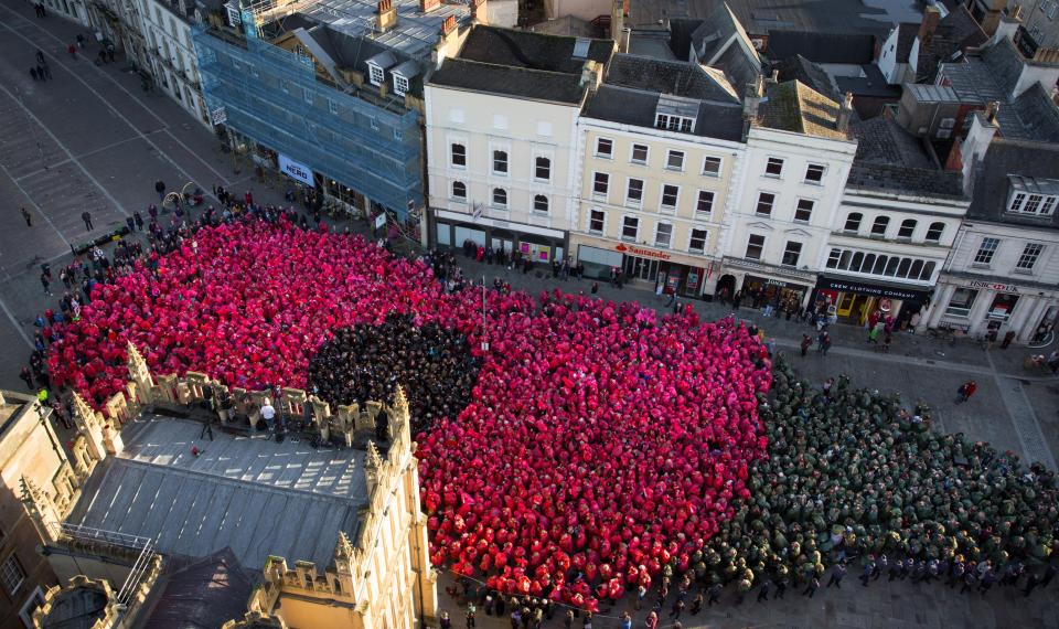  In Cirencester over 3,000 people in coloured ponchos organised themselves to create a poppy