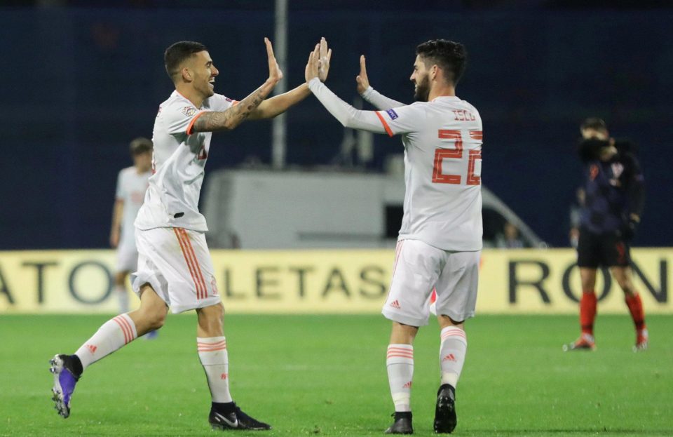  Isco helps Dani Ceballos celebrate his instant equaliser for the visitors