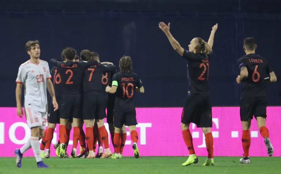  Spain's Sergi Roberto reacts as Croatia's Andrej Kramaric celebrates his opener