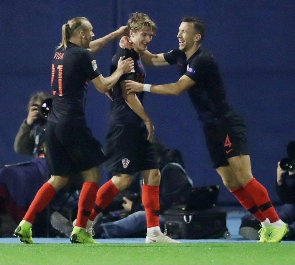  Croatia salute surprise late hero Tin Jedvaj after he clinched a 3-2 win over Spain