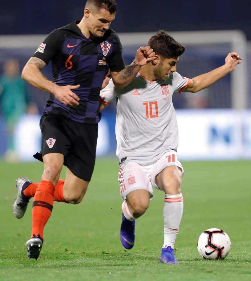  Dejan Lovren tussles with Spain wideman Marco Asensio during an important win for Croatia