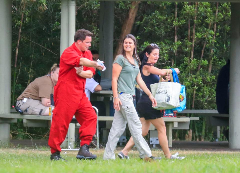  The stars changed into jumpsuits before they prepared to make the 10,000ft leap, with John Barrowman donning a red one