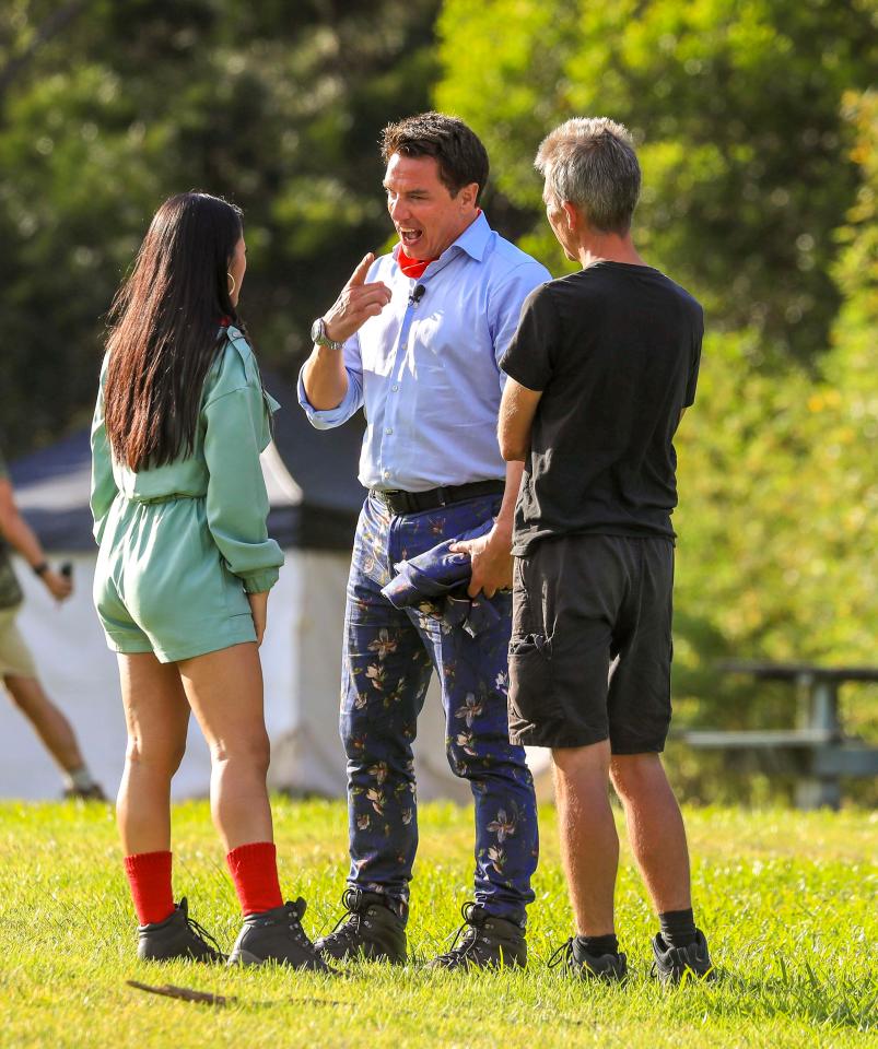  John and Sair chat to a member of the crew as they build up their nerve to make their jump