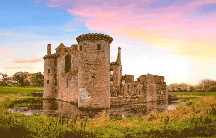  Caerlaverock Castle in Dumfries and Galloway, Scotland, is a moated triangular fortification first built in the 13th century by the Maxwell family