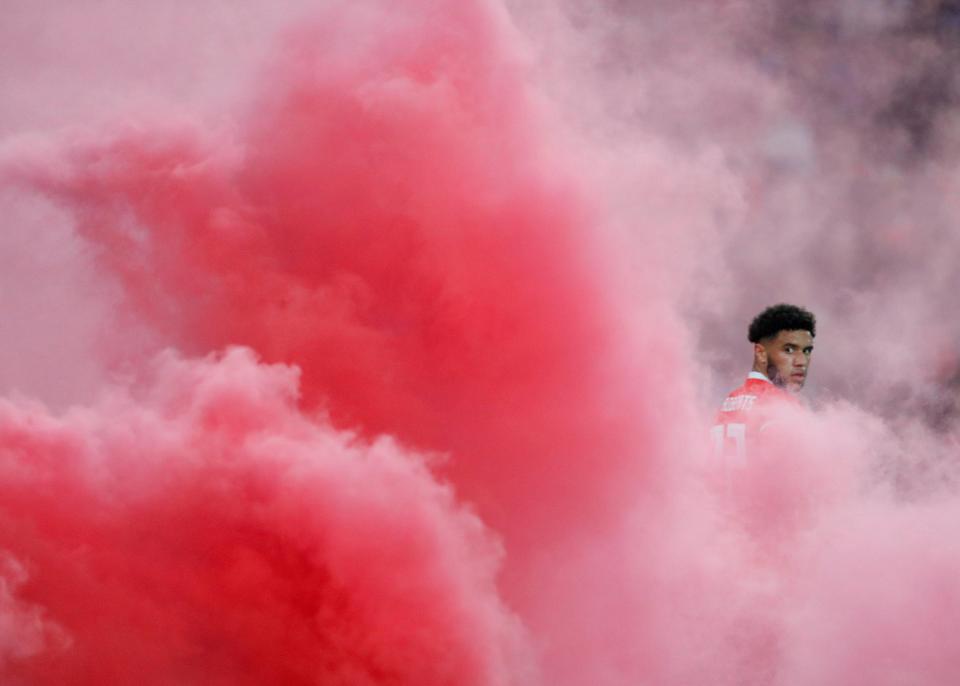  Wales' Tyler Roberts engulfed by the smoke