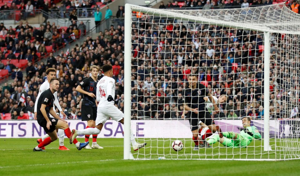 Jesse Lingard scores England’s equaliser in their 2-1 win over Croatia yesterday