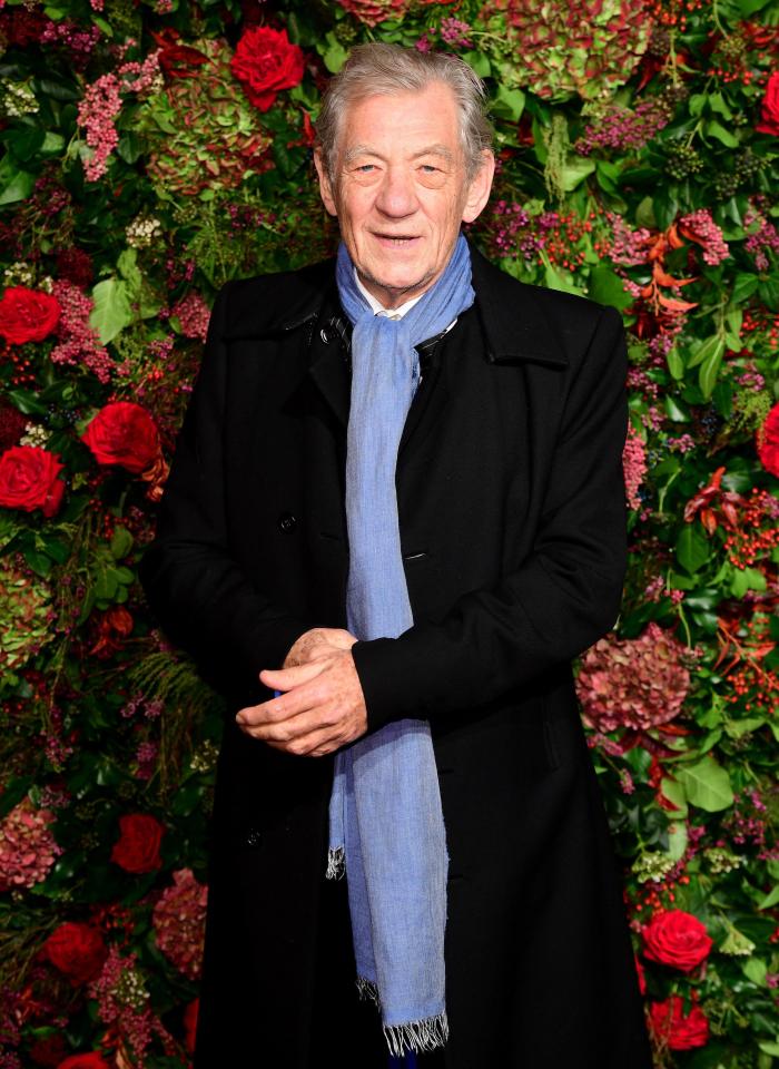  Sir Ian McKellen wrapped up in a black coat and blue scarf