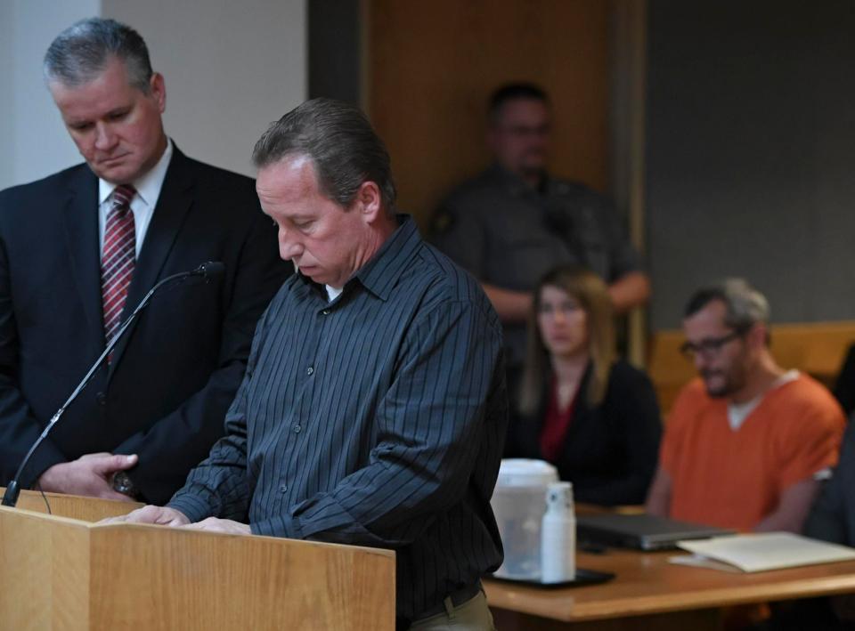  Michael J. Rourke, Weld County District Attorney, left, stands with Frank Rzucek, the father of Shanann Watts, as he reads a statement during court at the Weld County Courthouse on Monday, saying his son-in-law 'carried them out like trash'