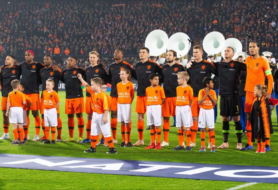  Van Dijk handed his jacket over to the mascot during the national anthems before Friday's game against France