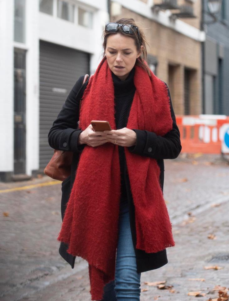  The mum-to-be wrapped up warmly as she braved the London cold