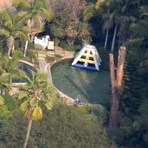  Brad's six kids can hang out in a pool with a huge water slide