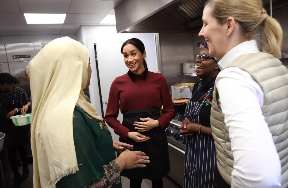 The actress was smiling and laughing with others in the kitchen this morning