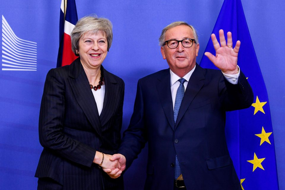  Theresa May with EU chief Jean-Claude Juncker