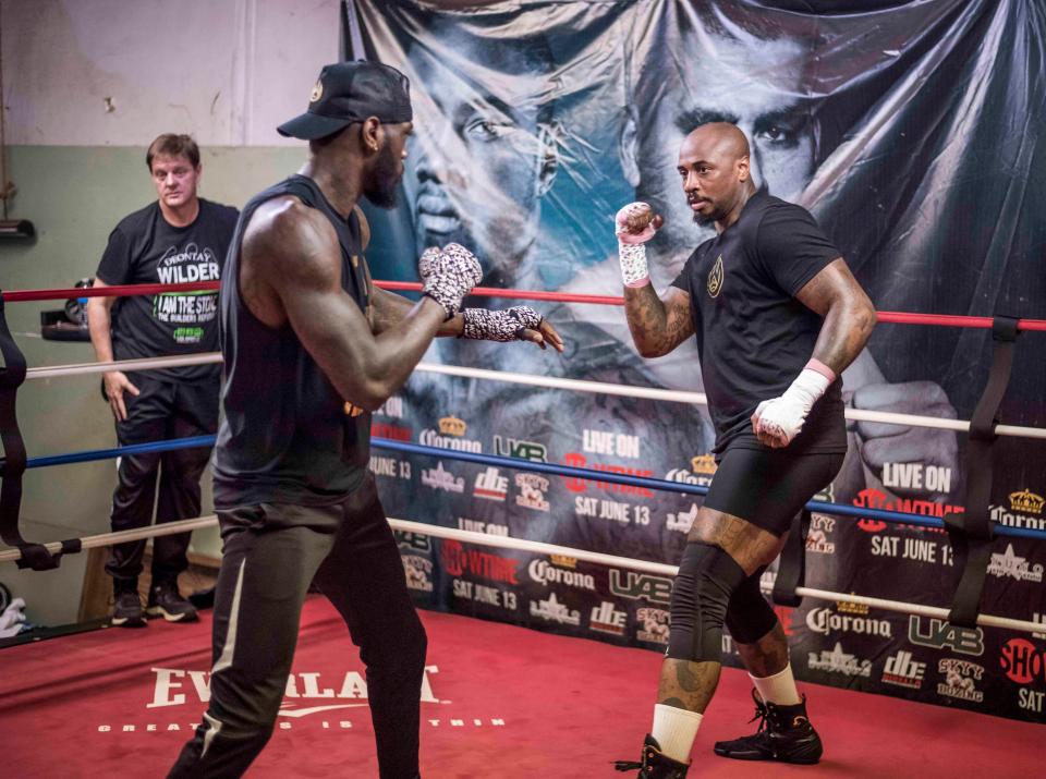  Wilder, left, in a sparring session with Malik Scott on Thursday