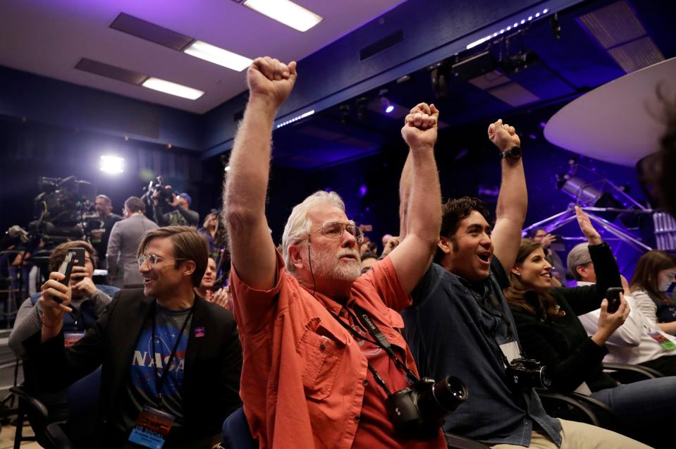  Hurrah! Nasa employees celebrate after InSight completes the first landing on the planet in six years