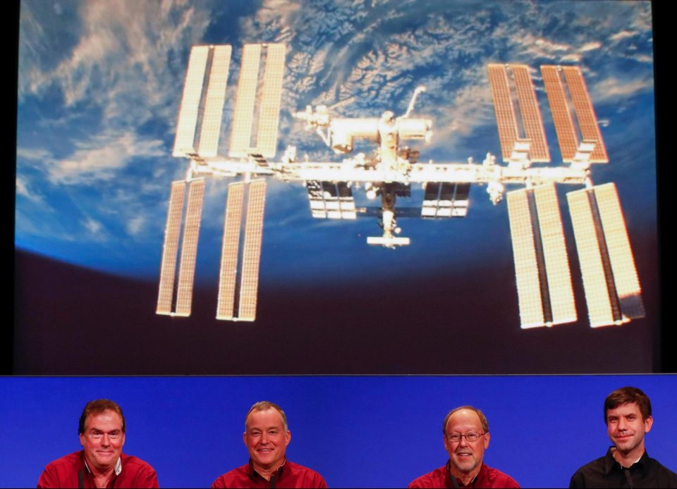  Astronauts on the International Space Station congratulate, from left to right, Michael Watkins, JPL director, project manager Tom Hoffman and scientists Bruce Banerdt and Andrew Klesh after the landing of the spacecraft