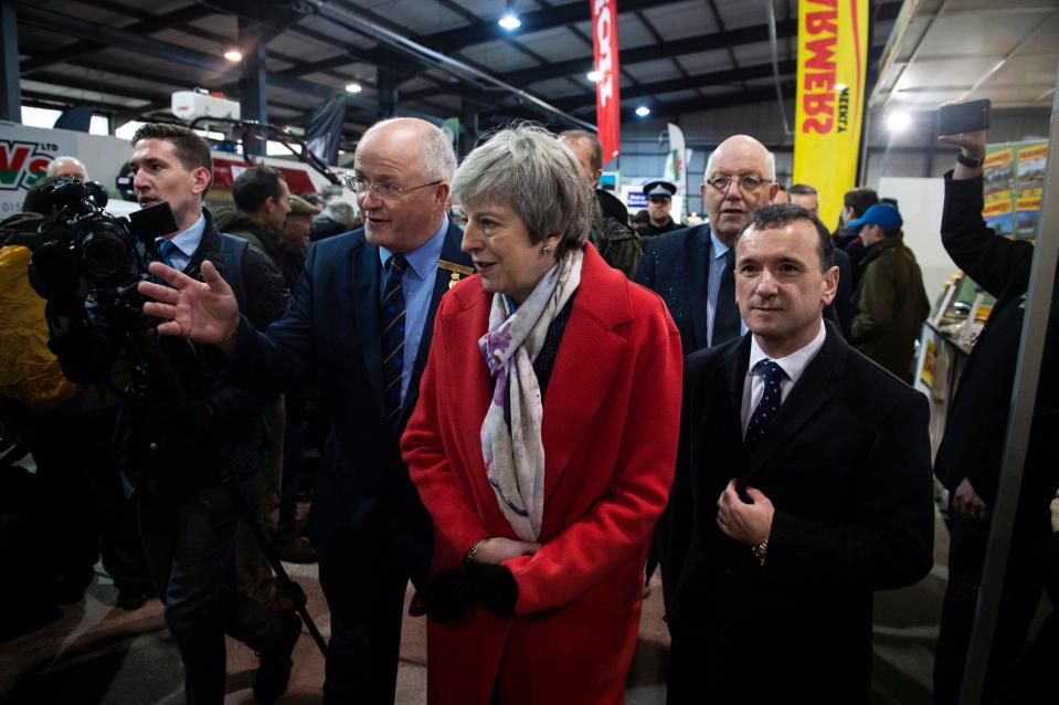  Theresa May and Secretary of State for Wales Alun Cairns meet with traders at the Royal Welsh Showground, Builth Wells, trying to win hearts and minds to her Brexit