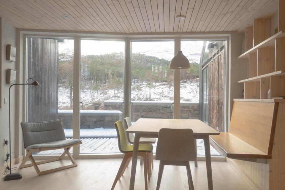  The dining room window looks out onto the snowy mountains