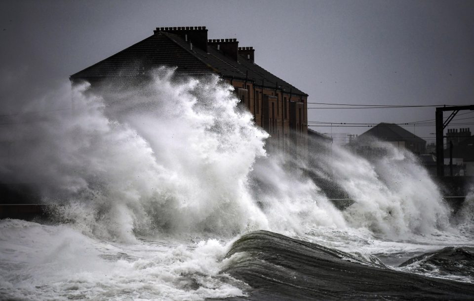  Waves crash in against the harbour wall in Saltcoats, Scotland.