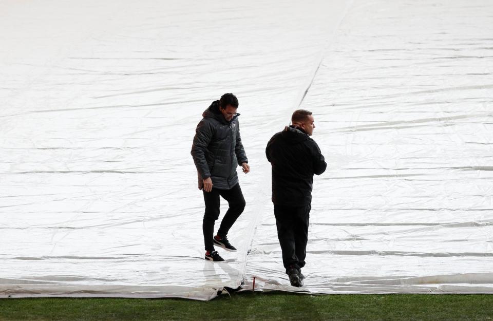  The pitch for Arsenal's game against Vorskla Poltava also has a large cover across it