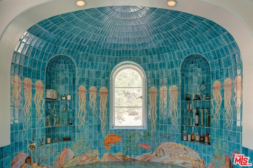  Each bathroom is lined with ornate wacky tile murals