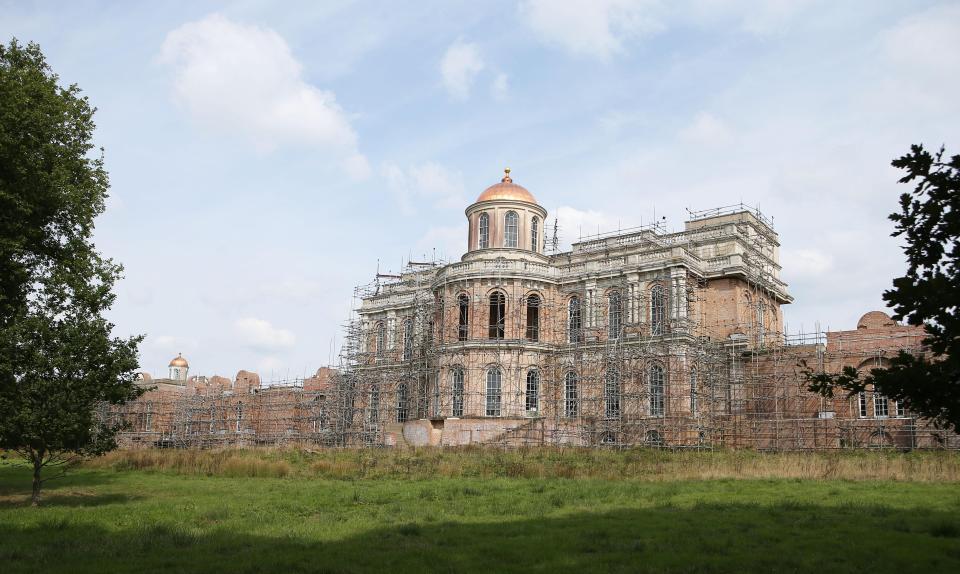  Scaffolding shrouds the mansion - which has been under construction for more than three decades