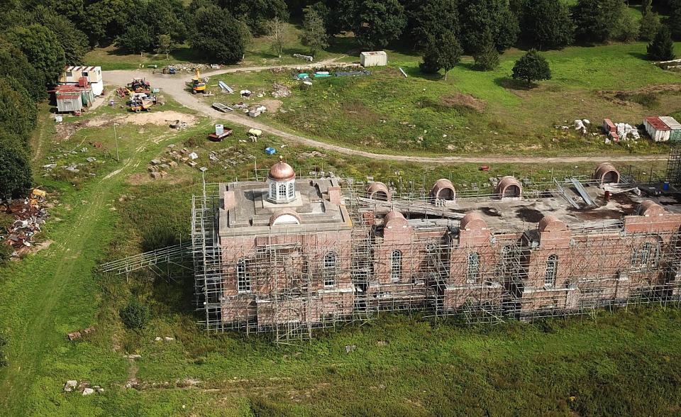  The lush surroundings have been tarnished by debris and storage containers