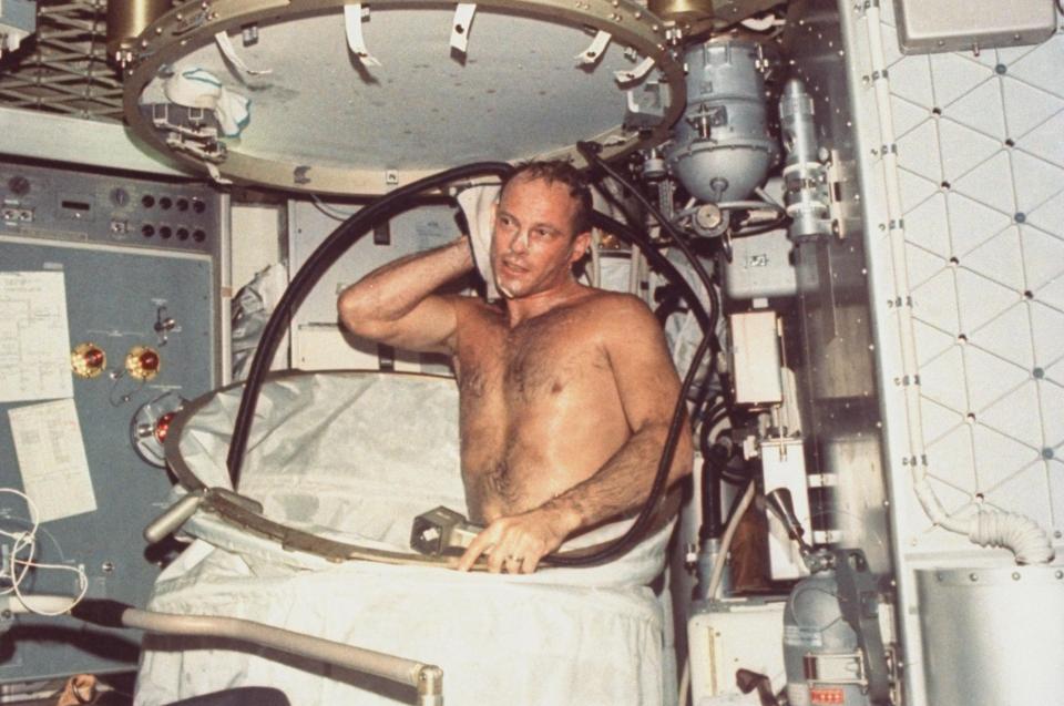  Another issue with sex in space is that all fluid from the romping would pool and float around the cramped cabin. Pictured: An astronaut taking a shower in the Skylab station in the 1970s