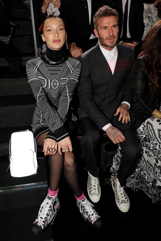 Bella almost looked a little awkward sat next to Becks as she crossed her arms and legs