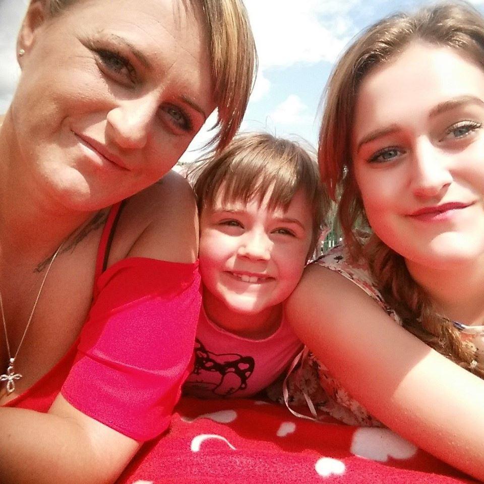  Debbie (here with daughters Mollie, 9, and Kayleigh,21) has been helped out by the DWP to get a better debt repayment scheme - after being contacted by The Sun